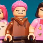 Lego version of Huntr/x smiling at something off-screen.