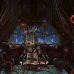 An astronaut stands in a cockpit.
