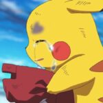 Pikachu crying while holding a hat