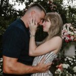 Taylor Swift and Travis Kelce embrace in engagement photo
