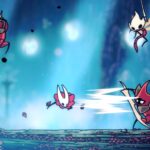 Hornet fights enemies in a blue cavern.