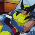 Wolverine sits in bed.