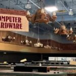 An abandoned Fry's electronics shows signs for computer hardware.