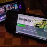 A Steam Deck and ROG Ally X stand on kickstands,