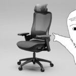 A soyjack meme character points at a desk chair.