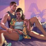 A man and woman sit in a bed.