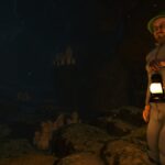 The protagonist of Baby Steps holds a lantern in the dark.