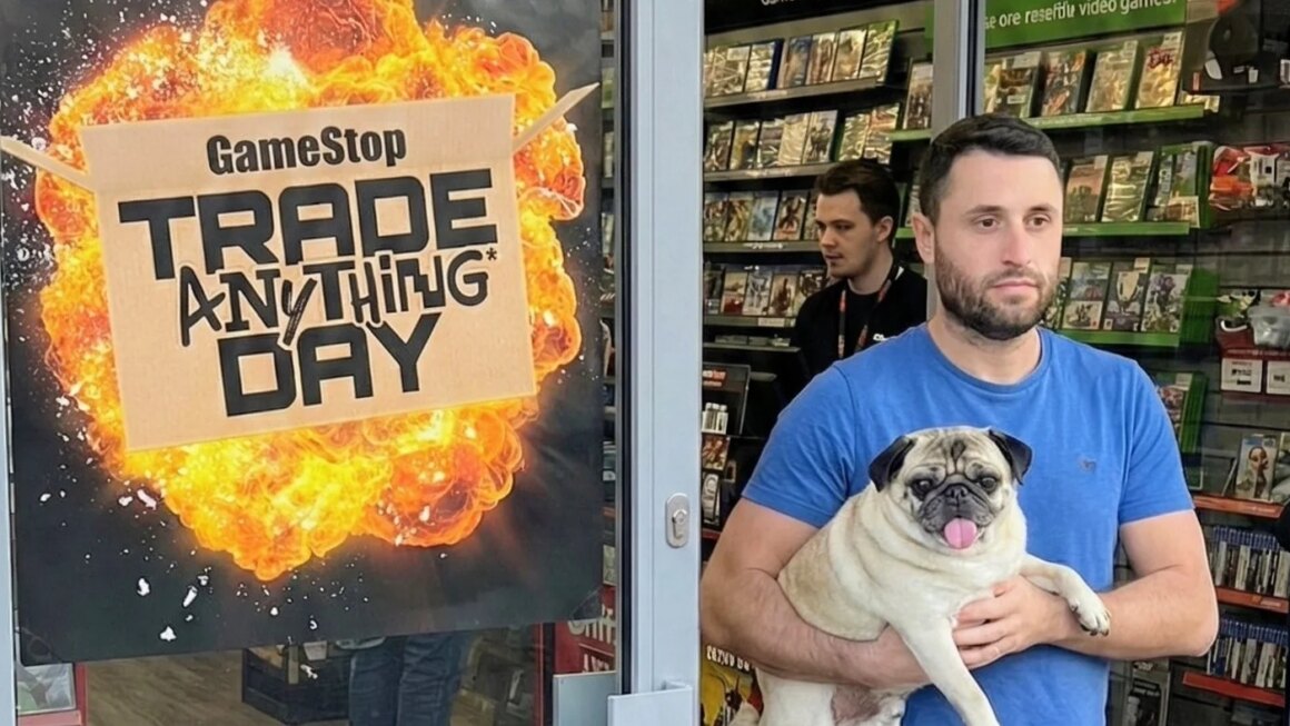 A man carries a Pug out of GameStop.