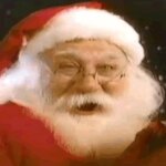 Santa holds a controller.