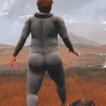 A man walks through a field.