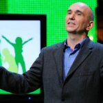 Peter Molyneux stands on stage at an Xbox show.
