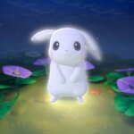 A white Pikachu looks at the camera while standing in a forest.